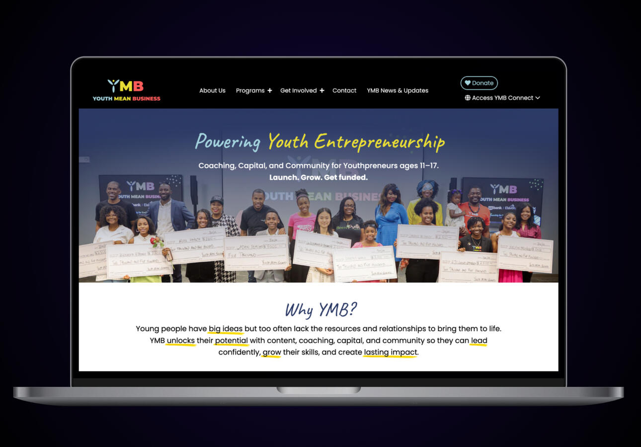 A macbook laptop displaying the Youth Mean Business website landing page